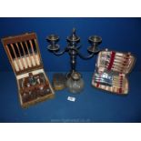 A silver plated candelabra, a silver topped scent bottle A/F, a gents clothes brush,