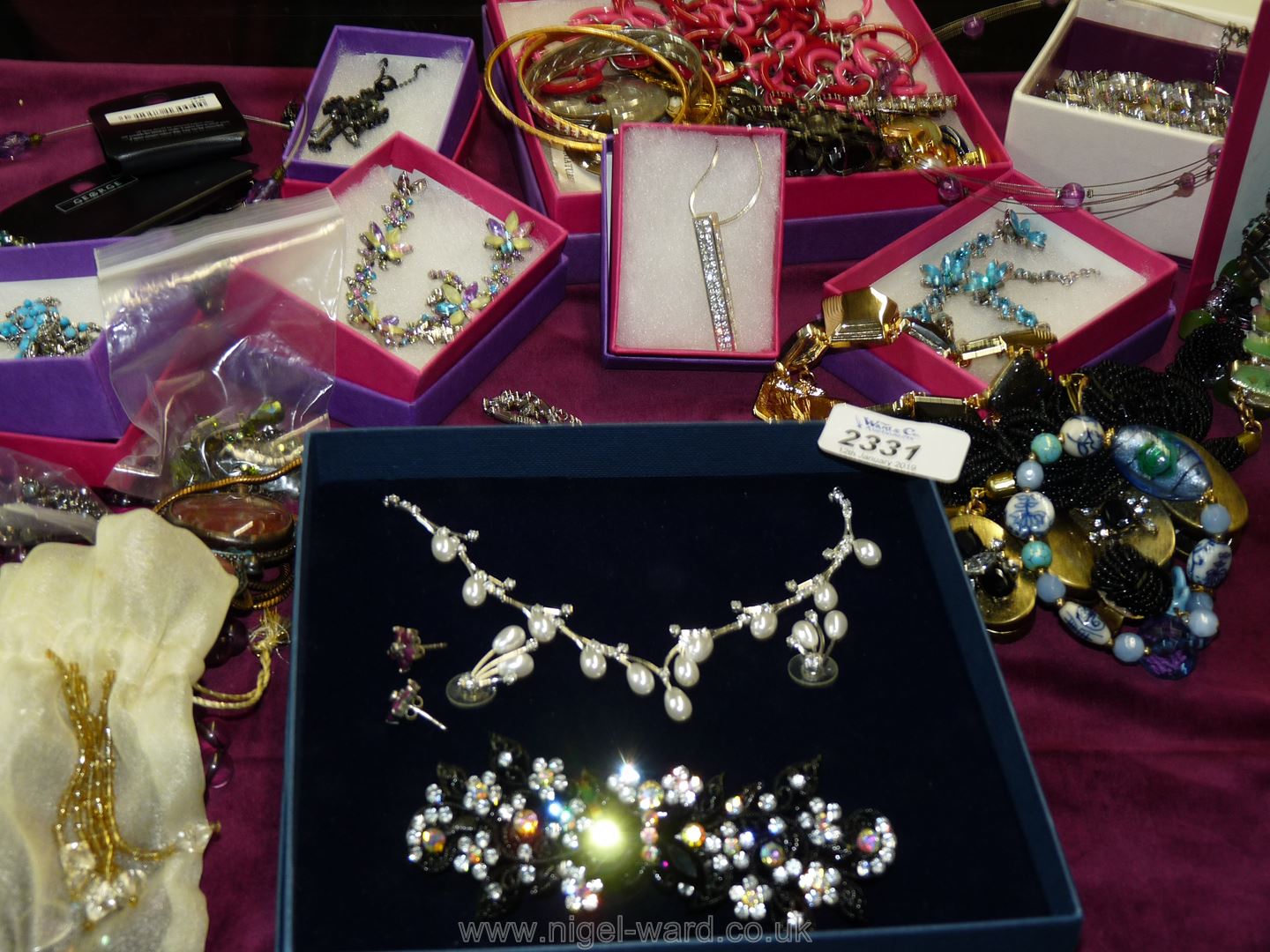 A box of costume jewellery.