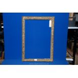 An antique English carved and gilded oak leaf picture Frame, 19" x 27 1/2" approximately.