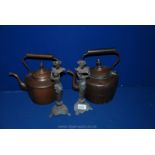 Two Copper Kettles and two brass Candlesticks.