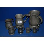 Several antique Pewter measures, tankard,