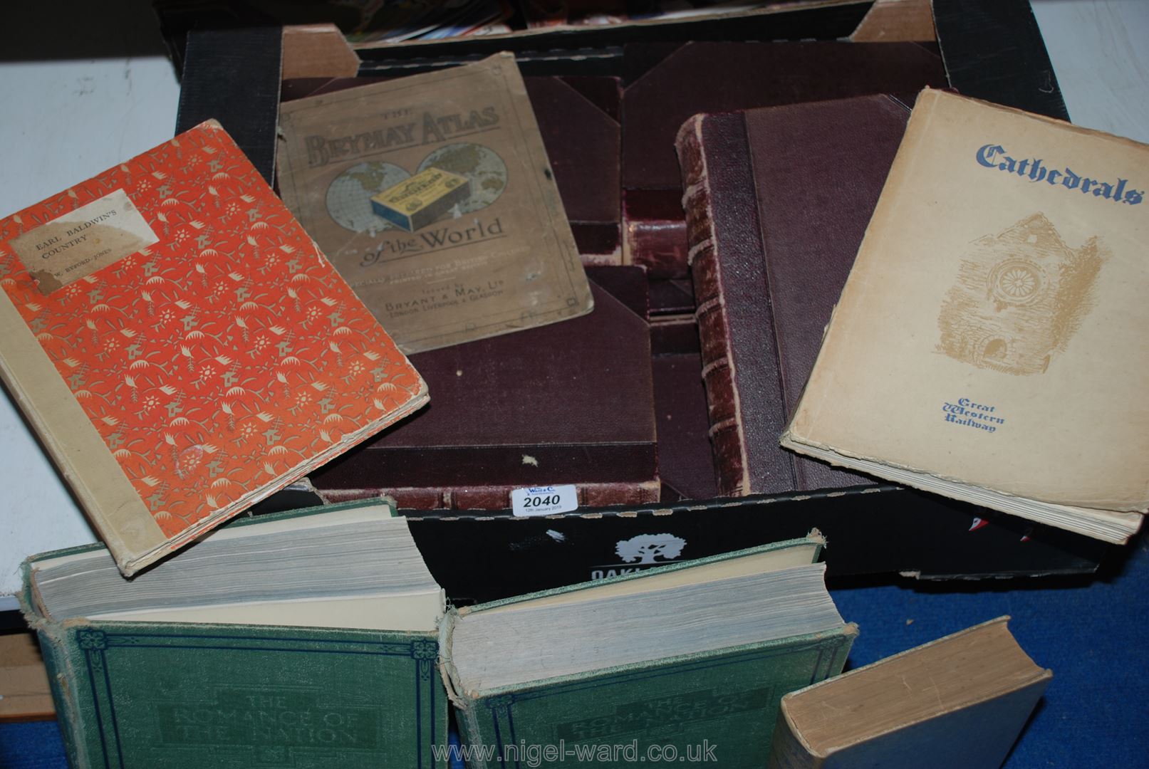 A box of books to include; Chambers Encyclopaedia, Cathedrals, Earl Baldwin's country, etc.