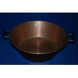 A heavy handled beaten Copper preserving Pan, 15" diameter.