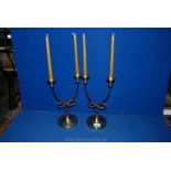 A pair of art deco style brass and copper Candlesticks with four candles.