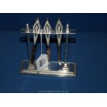 A stunning Art Deco silver and enamelled Manicure set with silver architectural rectangular stand,