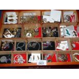 A wooden box, full of various costume jewellery (over 98 items in total).