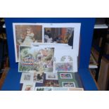 A folder with large quantity of new and old Prints