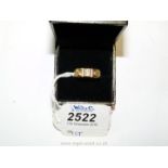 A 9ct gold and diamond wedding band.