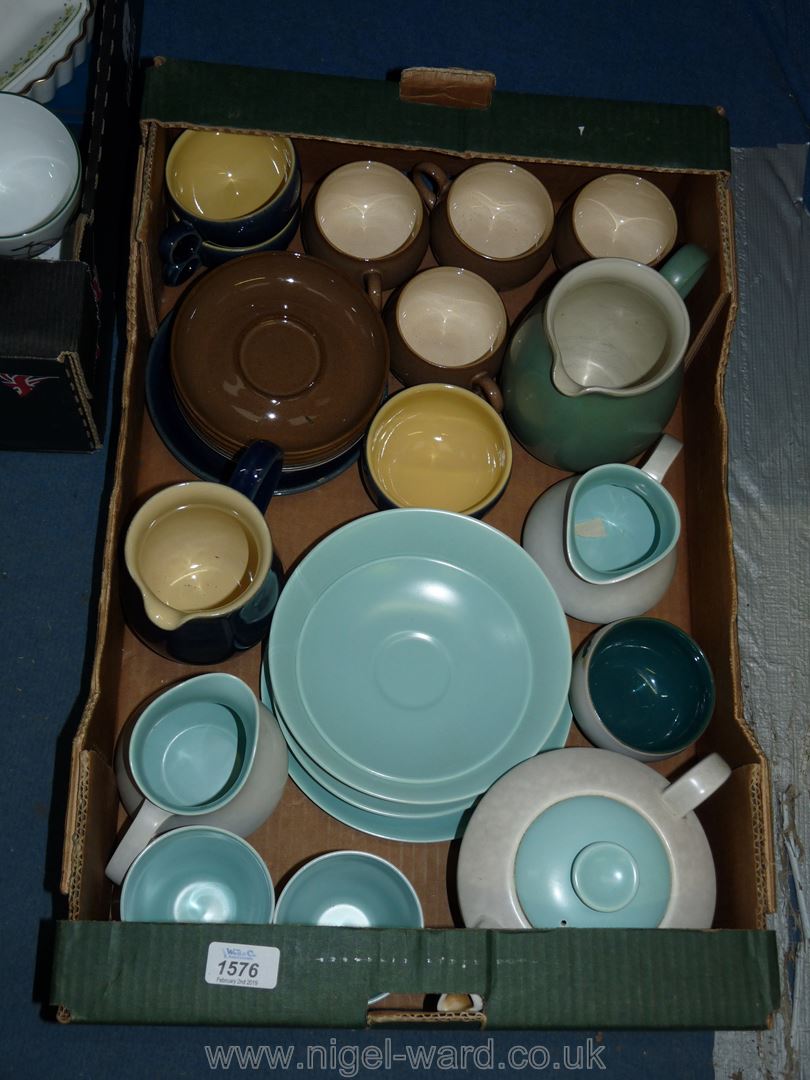 A quantity of Poole and Denby cups, saucers, teapots, jugs etc.