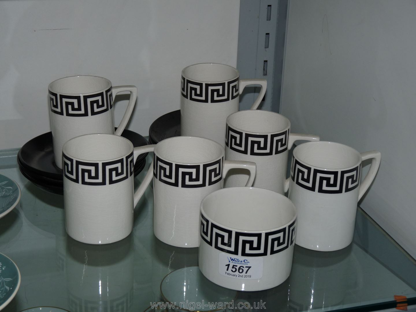 Six Portmeirion black and white Greek key coffee mugs, saucers and sugar bowls.