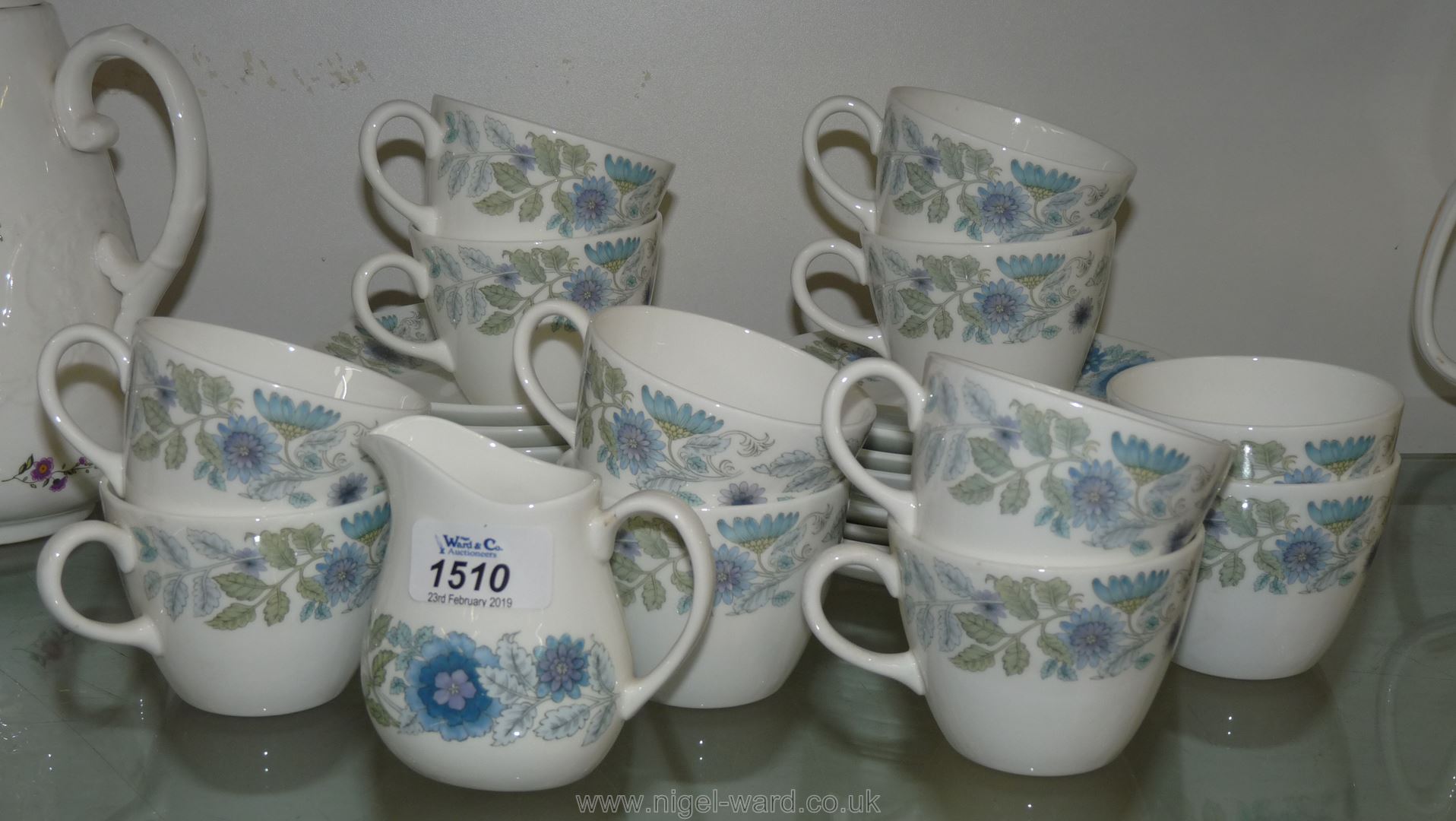 A quantity of Wedgwood 'Clementine' Teaware comprising eleven cups, eight saucers,