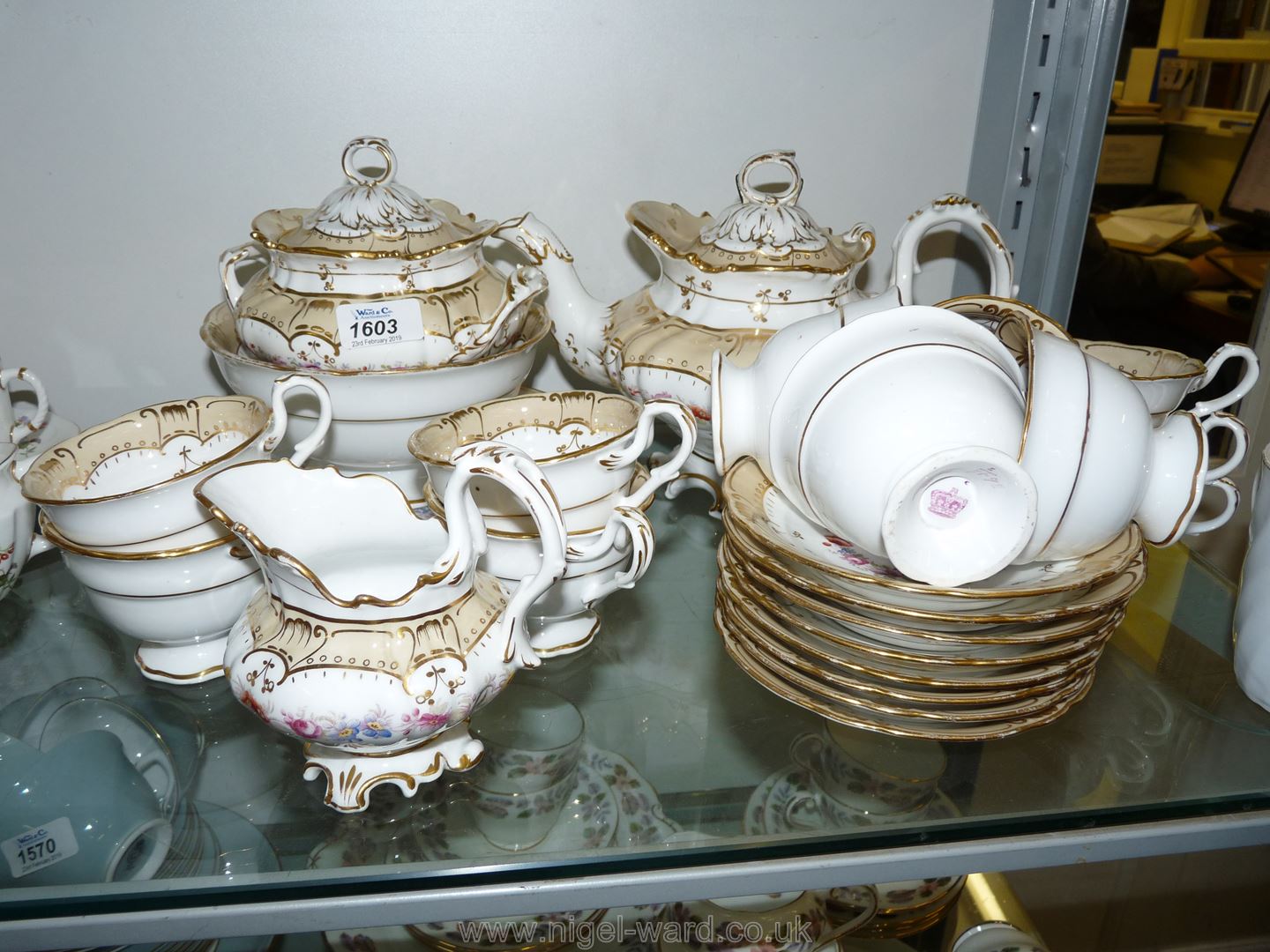 An early Victorian Teaset in the Rockingham style, white ground with floral pattern,