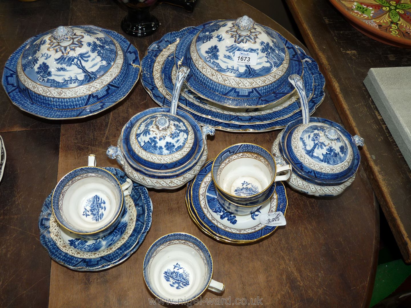 A quantity of Booths 'Old Willow' china including two meat plates, sauce tureens and ladles,