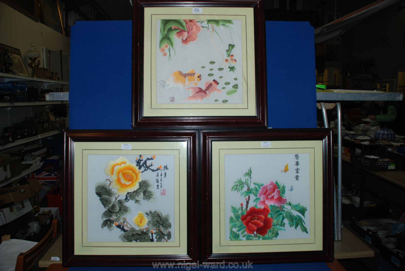 Three framed Chinese flower pictures.