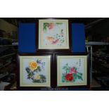 Three framed Chinese flower pictures.