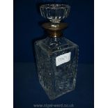 A glass square decanter and stopper having a silver neck London mark.