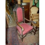 An Oak framed splayed open armed Hall elbow Chair having turned arm supports,