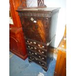 A continental style dark Mahogany Cabinet/Bureau, with fall front over four short drawers,
