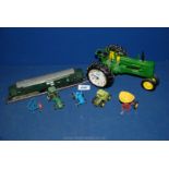 A John Deere tractor/clock and various miniature tractors.