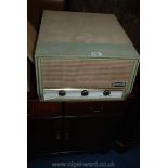 A ''Dansette Conquest Auto'' record Player, (15/3/45/78 rpm) having cream and pale green case.