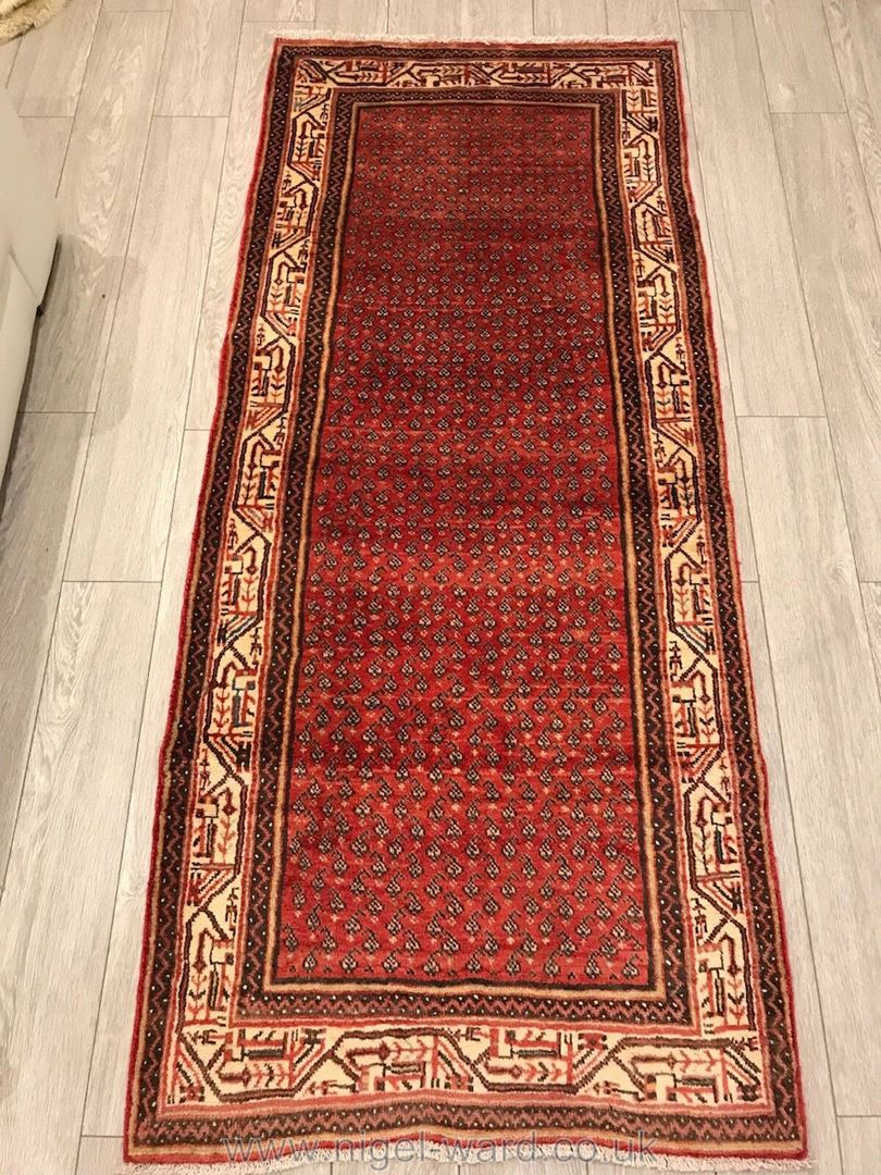 A hand-made red Bijar Runner,