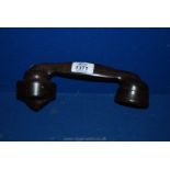 A 1930's Bakelite telephone handset.