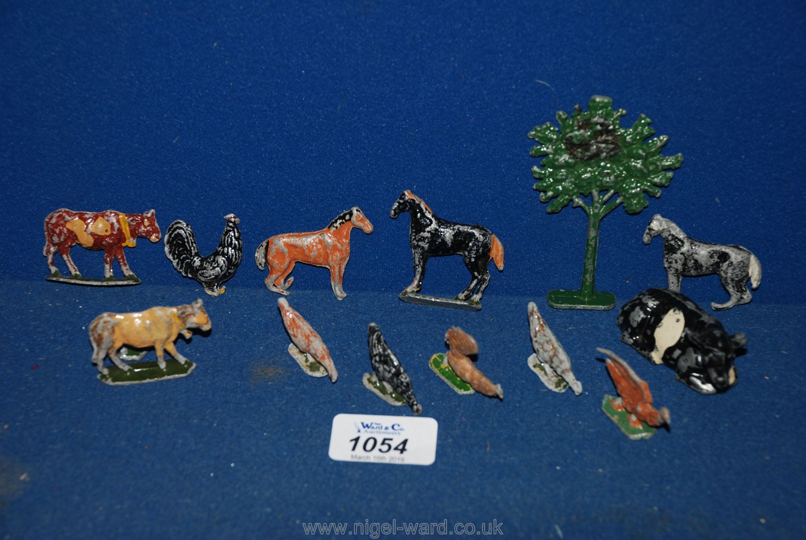 A small quantity of lead animals including cow, tree, chickens, horses, etc.