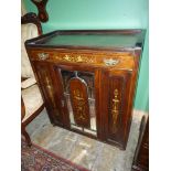 A circa 1900 Mahogany and Walnut Cabinet profusely decorated with inlays of boxwood and ivory,