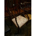 A Mahogany framed open armed Carver Chair having pale beige ground,
