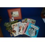 A box of Ladybird books, painting of Spitfire, carved bottle stoppers,