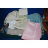 A quantity of baby items including blankets, cot sheets, rug, powder pot, soap dish and brush.