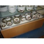 A comprehensive set of Staffordshire Dinner service with oriental style pattern with floral border