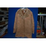 A genuine ladies sheepskin coat, size 38.