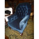 A circa 1900 button backed low Armchair,