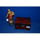 A Japanese lacquered musical trinket Box and a Victorian French spelter figure;