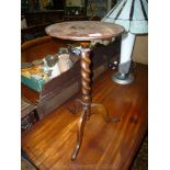An Oak Wine Table standing on twist column with three splay feet,