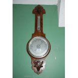 An Oak cased aneroid Barometer and thermometer,
