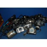 A large quantity of SLR film Cameras to include; Minolta, Nikon, Canon, etc.