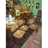 A set of five Satinwood framed rustic Dining Chairs of early design having seagrass seats and backs,