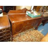 A circa 1940 Oak Sideboard standing on cabriole legs and having a central flight of three short
