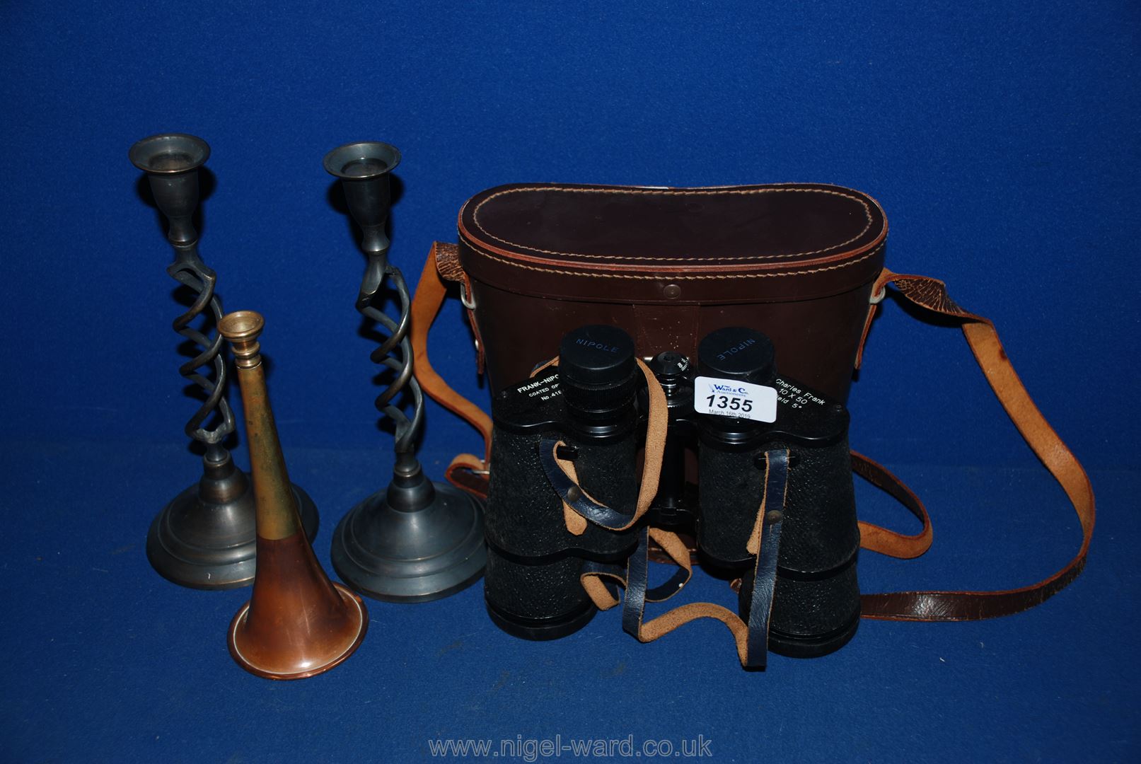 Two metal candlesticks, small hunting horn and a pair of 10 x 50 Binoculars,