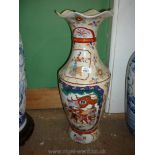 A colourful oriental floor Vase decorated with panels of warriors and flowers,