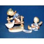 Two Hummel figures, cherub and Barnyard Hero.