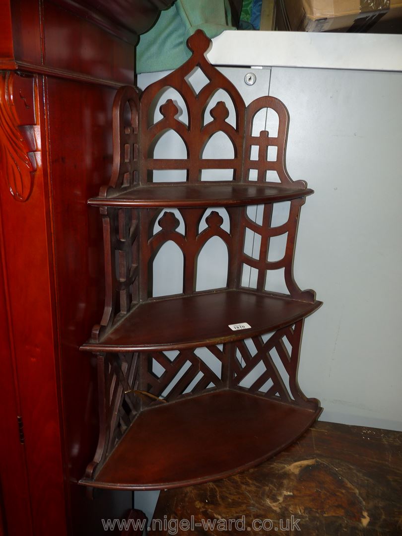 A Mahogany wall hanging three stage corner Shelf unit having fretworked detail/frame,