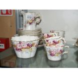A dainty floral Victorian part Teaset comprising bread and butter plate, five tea plates,