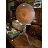 A snap top Mahogany occasional Table having a ridged turned pillar, three splay feet,