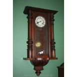 A Mahogany cased Vienna type Wall Clock having two train spring action movement,