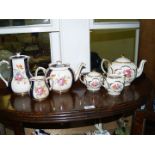 A Sadler teapot, milk jug (chipped) and lidded sucrier together with a Sadler teapot, hot water jug,