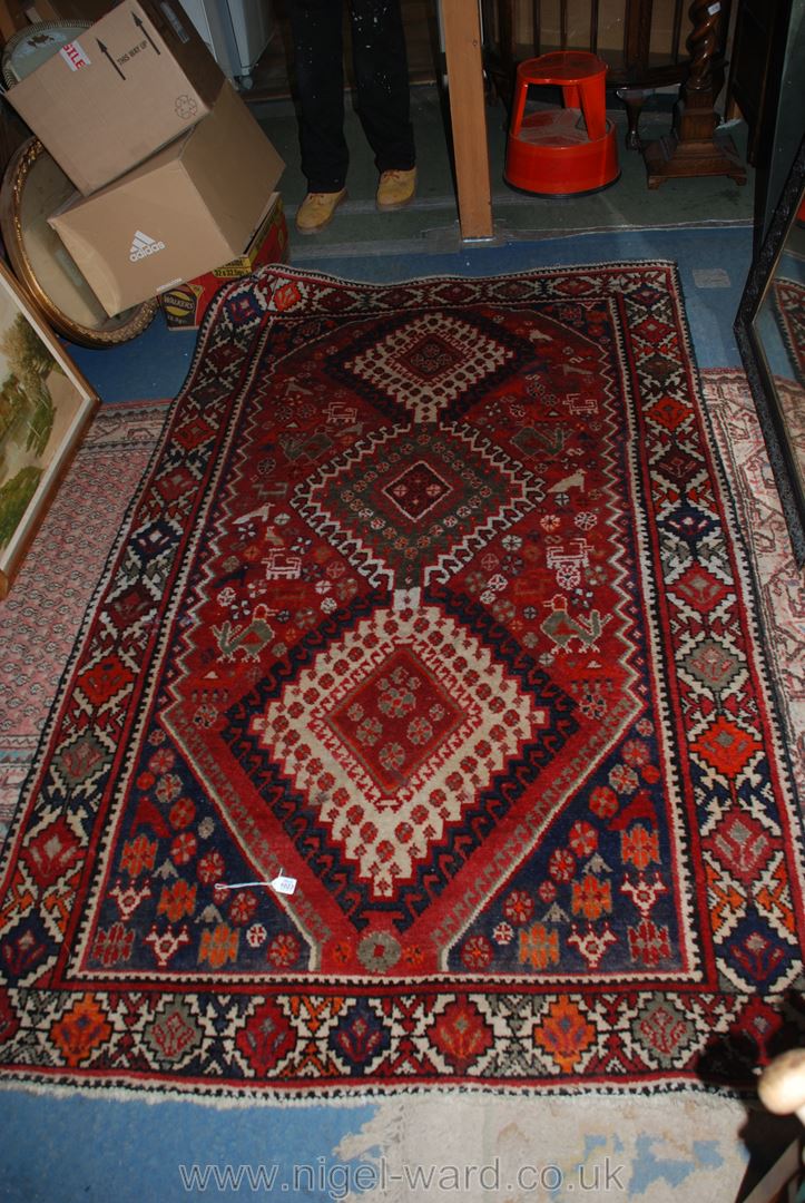 A red patterned wool Rug.