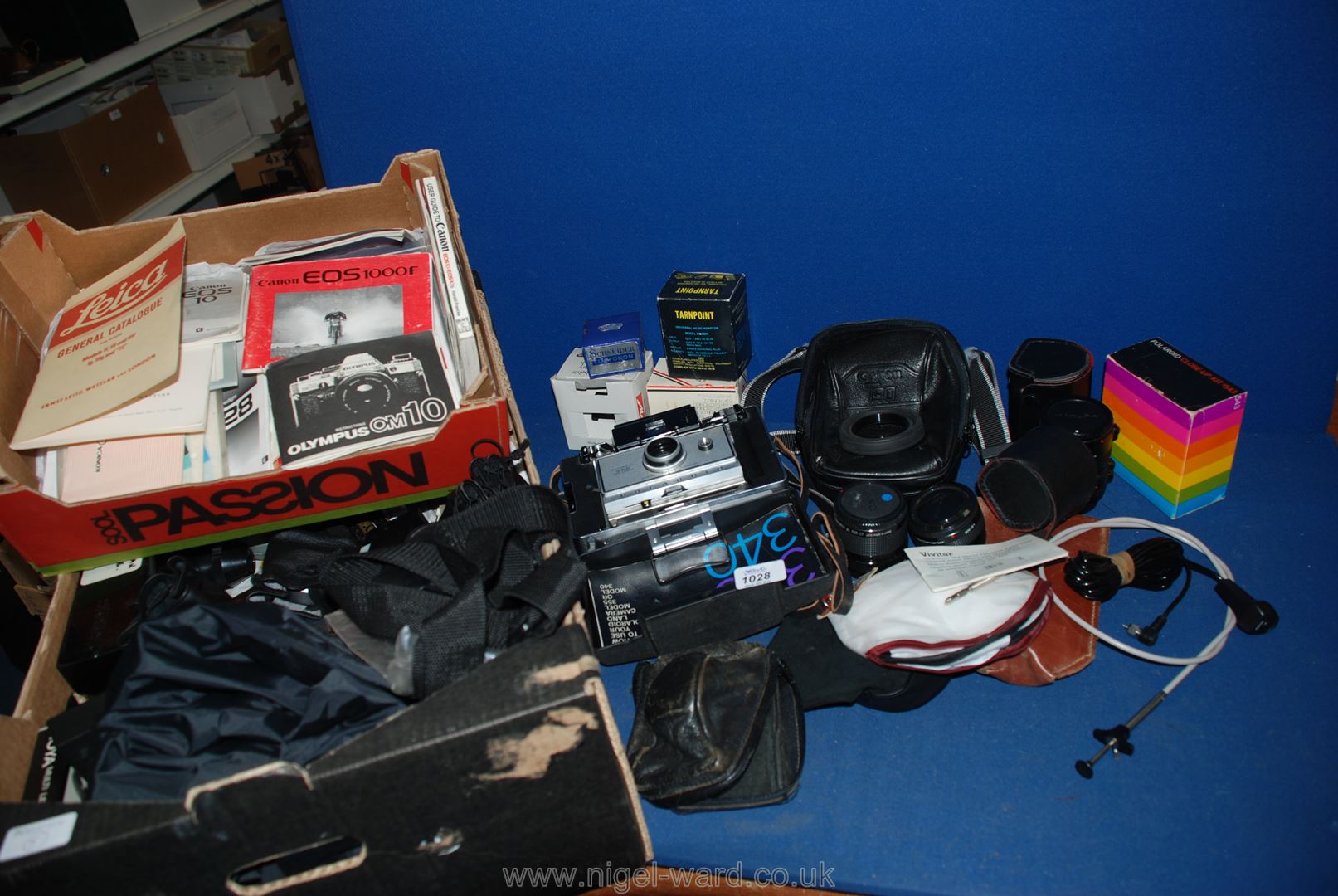 A large quantity of assorted camera equipment to include; lenses, dark room equipment,